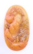 A model of a Chinese pebble carving. 9.5 cm high.