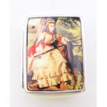 A silver pill box depicting a girl. 3.25 x 2.5 cm.