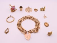 A 9 ct gold bracelet and charms. Bracelet 18 cm long. 58.6 grammes.