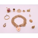 A 9 ct gold bracelet and charms. Bracelet 18 cm long. 58.6 grammes.