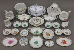 A collection of small Herend porcelain pieces, including bon bon dishes, jugs, etc.
