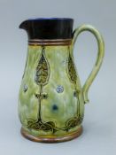 A Royal Doulton stoneware baluster jug. 19 cm high.