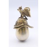 A silver egg and helmet pendant. 4 cm high.