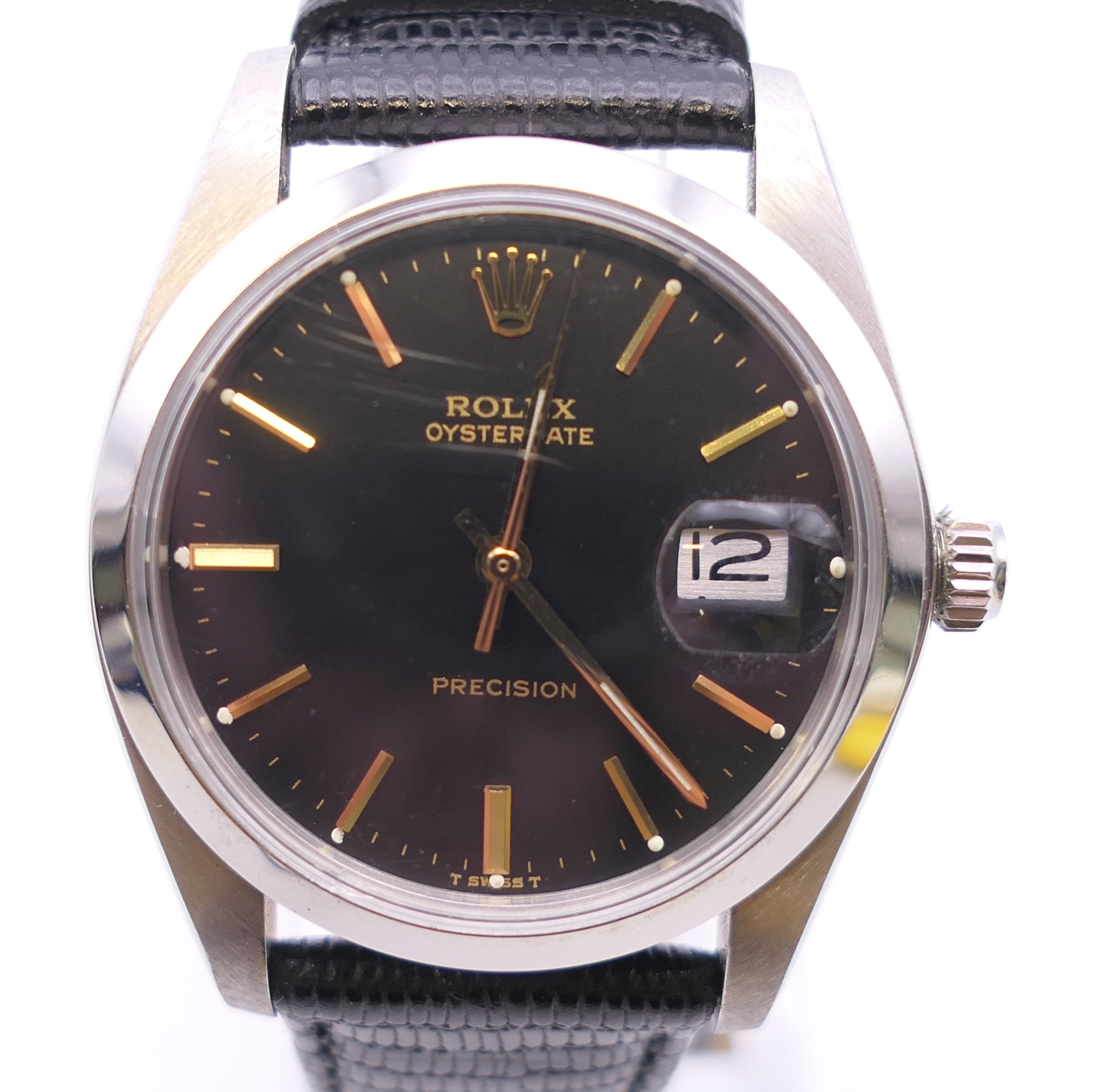 A Roxlex Oysterdate black dial with date aperture gentleman's wristwatch. 3.75 cm wide.