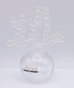 A Lalique R France perfume bottle. 12 cm high.