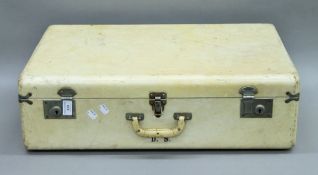 A vintage suitcase with insert and red silk lining by Ford Sherington Sydney. 65 cm long.