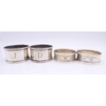 Two pairs of silver napkin rings, hallmarked Birmingham 1932 and 1984. One pair 2.5 cm high, 4.