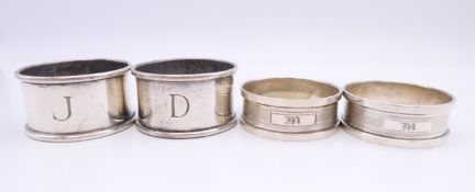 Two pairs of silver napkin rings, hallmarked Birmingham 1932 and 1984. One pair 2.5 cm high, 4.
