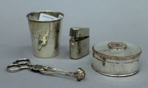 A 900 silver beaker, a pair of sugar tongs, a coin set plated box and a travelling inkwell.