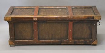 A metal and leather bound trunk. 132 cm long.