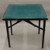 A 20th century baize topped folding card table.