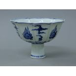 A Chinese porcelain stem cup. 12 cm high.