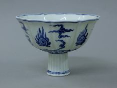 A Chinese porcelain stem cup. 12 cm high.