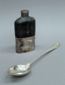 A silver plated serving spoon and a silver plated hip flask. The latter 17.5 cm high.