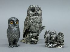 Two silver clad owls and an owl pepper. The largest 11.5 cm high.