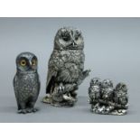 Two silver clad owls and an owl pepper. The largest 11.5 cm high.