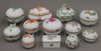 A collection of Herend porcelain trinket boxes.