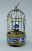 A cloisonne bird cage clock. 21 cm high.