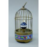 A cloisonne bird cage clock. 21 cm high.