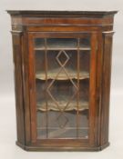An early George III mahogany glazed hanging corner cabinet. 80 cm wide.