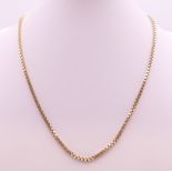 A small 9 ct gold chain. 44 cm long. 12.9 grammes.