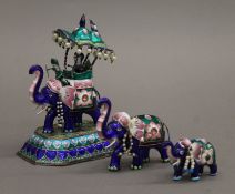 Three Indian silver models of elephants, enamelled and set with polished cabochons and pearls.