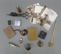 A quantity of miscellaneous items, including a scent bottle, lighters, a whistle, etc.