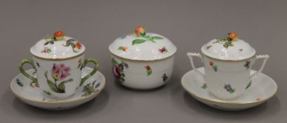 Two Herend porcelain lidded chocolate cups and a sucrier.
