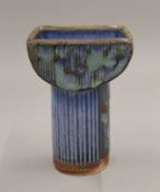 A Studio pottery candlestick. 15 cm high.