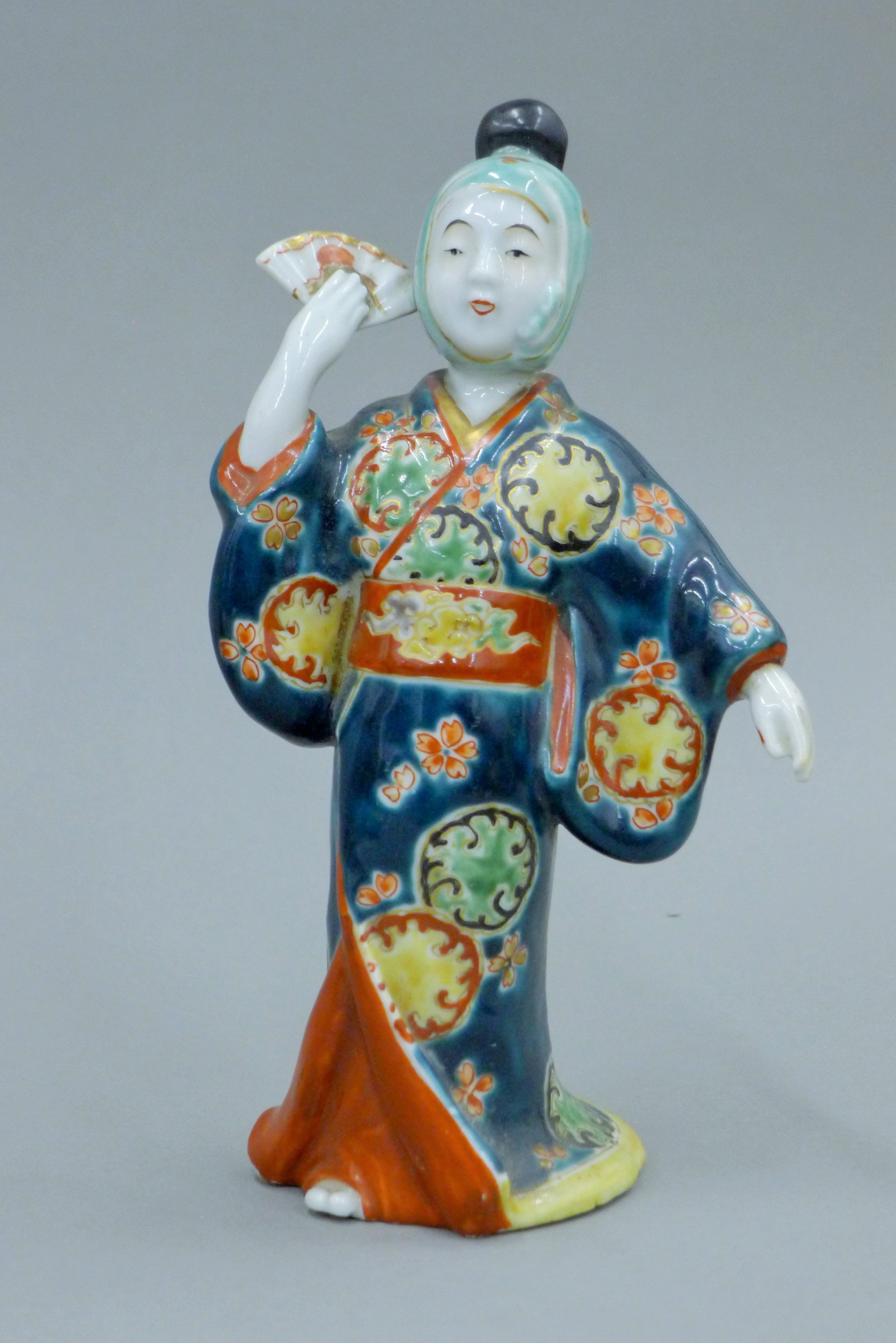 A pair of Japanese Meiji period porcelain figures. Each approximately 19 cm high. - Image 2 of 9