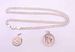 A silver necklace and two silver St Christopher pendants. Chain 50 cm long.