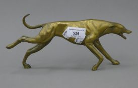 A brass model of a running greyhound. 26 cm long.