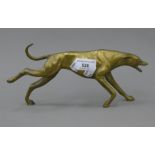A brass model of a running greyhound. 26 cm long.