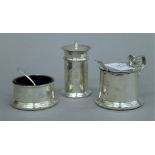 A three-piece silver cruet set. The pepper 7.5 cm high. 148.4 grammes total weight.