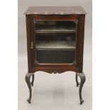 A late Victorian mahogany glazed display cabinet. 55 cm wide.