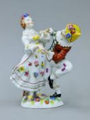 An early 20th century Rudolstadt porcelain 'Comedia del Arte' figural group,