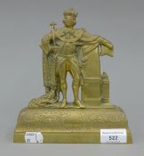 A Victorian brass mantlepiece ornament formed as a king. 19.5 cm high.