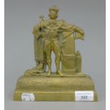 A Victorian brass mantlepiece ornament formed as a king. 19.5 cm high.