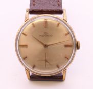 A Movado gold plated stainless steel mechanical wristwatch, ref 1031,