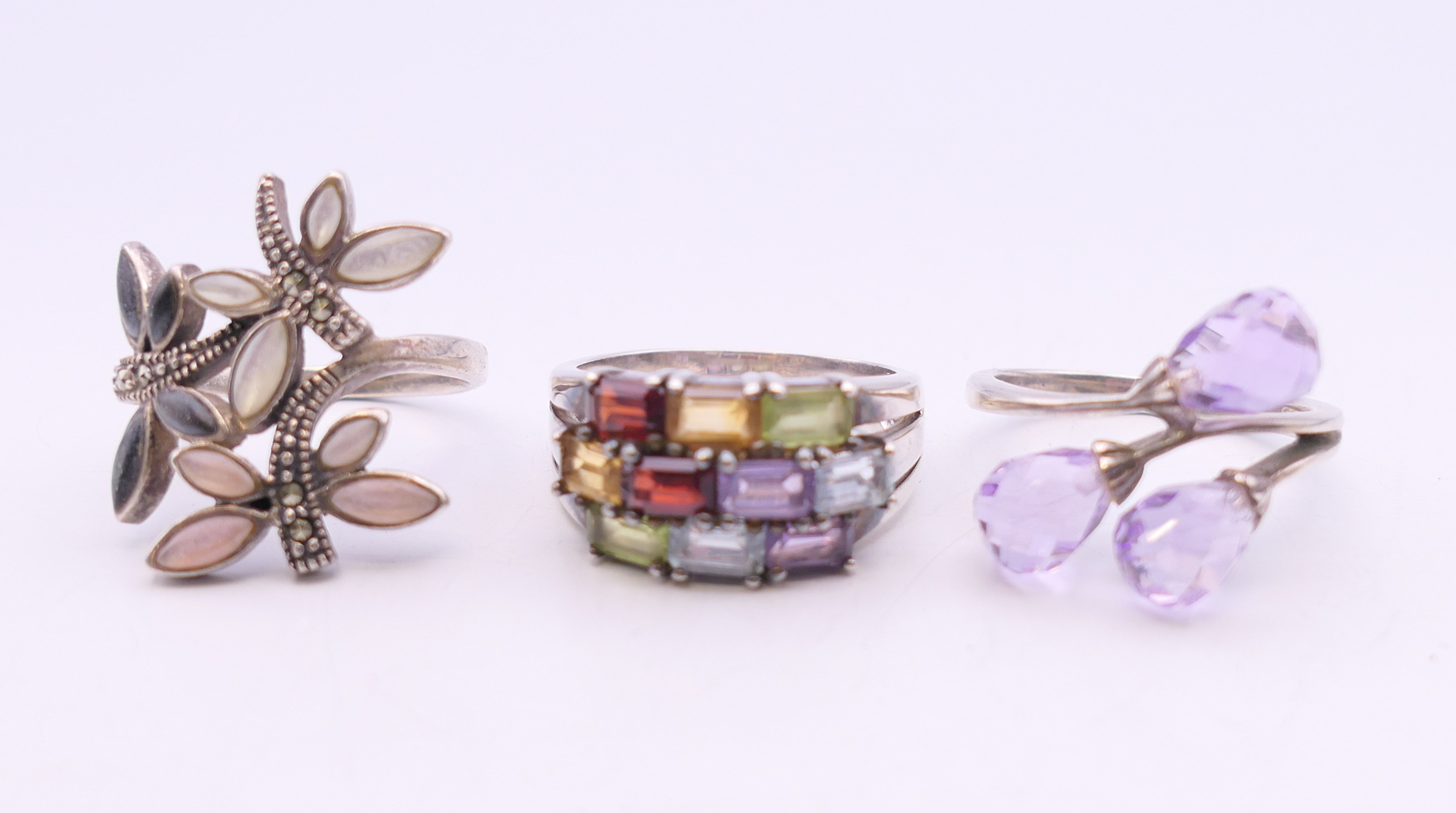 Three silver stone set rings