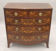 A George III mahogany later inlaid rosewood crossbanded bow front chest of drawers. 99 cm wide.