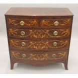 A George III mahogany later inlaid rosewood crossbanded bow front chest of drawers. 99 cm wide.