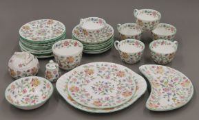 A quantity of vintage Minton Haddon Hall bone china tea wares, including cups and saucers,