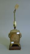 A Chinese brass lamp. 45 cm high overall.