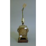 A Chinese brass lamp. 45 cm high overall.