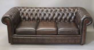 A Chesterfield settee. Approximately 190 cm wide.