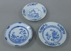 Three 18th century Chinese Export blue and white dishes. Each approximately 22.5 cm diameter.