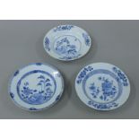 Three 18th century Chinese Export blue and white dishes. Each approximately 22.5 cm diameter.