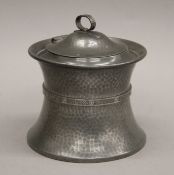 A 1920s Arts and Crafts style planished pewter biscuit barrel by Cooper Brothers,