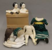 A quantity of Bartholomina unfinished ceramic doll's heads and limbs with real hair,
